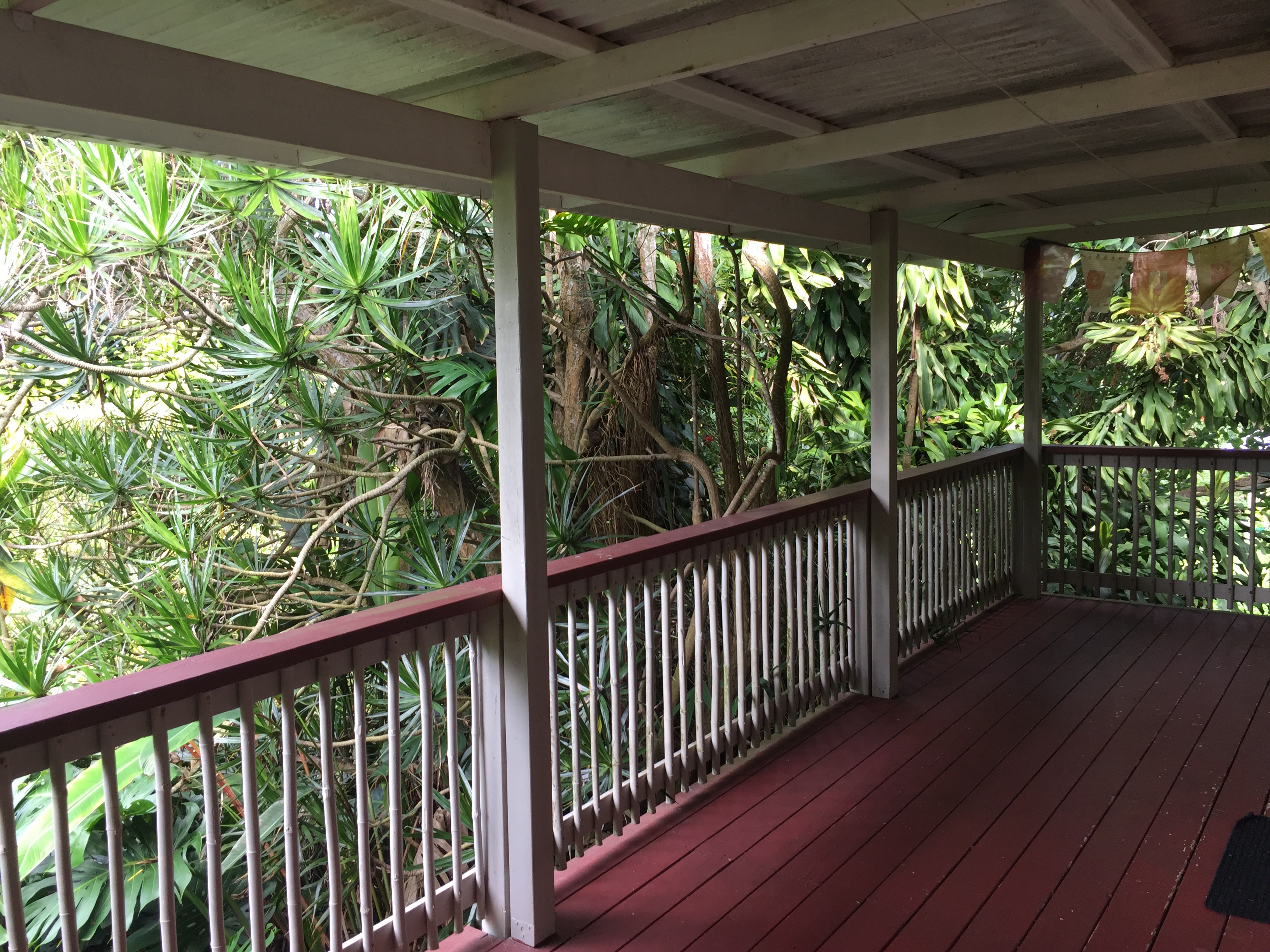 a view of a balcony with wooden floor