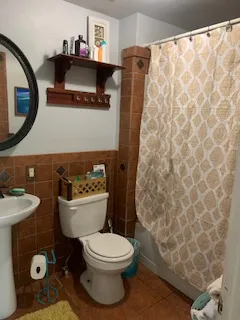a bathroom with a toilet and a sink