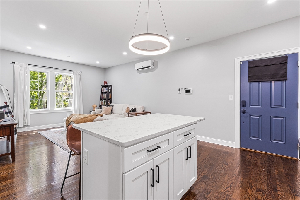 128 Hamilton Street, Unit 2B Boston, MA 02125 - Photo 5 of 23 a kitchen that has a cabinets and a table in it