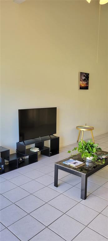 2218 Abbey Road Southwest Winter Haven, FL 33880 - Photo 11 of 31 a living room with furniture and a flat screen tv