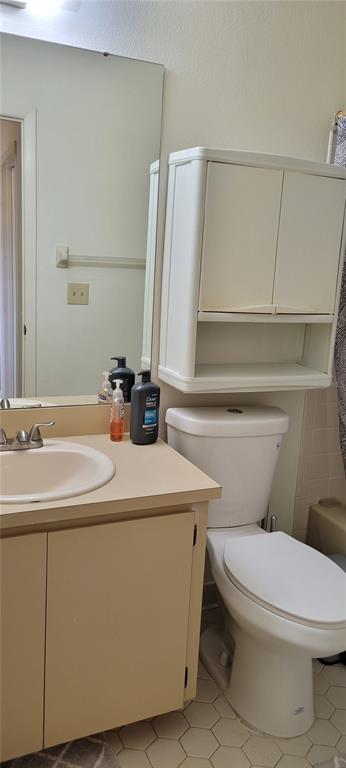 2218 Abbey Road Southwest Winter Haven, FL 33880 - Photo 23 of 31 a bathroom with a sink a toilet and mirror