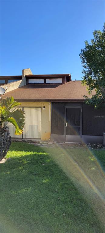 2218 Abbey Road Southwest Winter Haven, FL 33880 - Photo 26 of 31 a front view of a house with a garden