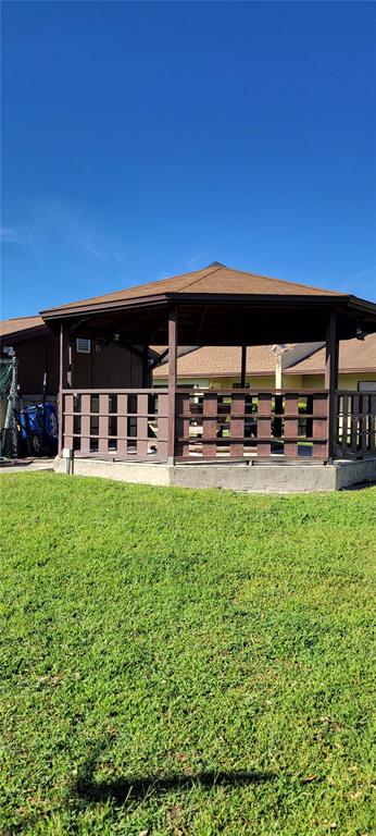 2218 Abbey Road Southwest Winter Haven, FL 33880 - Photo 29 of 31 front view of a house with a yard