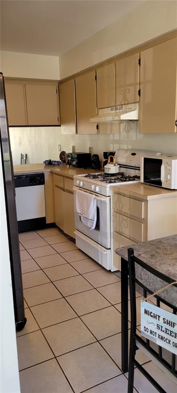 2218 Abbey Road Southwest Winter Haven, FL 33880 - Photo 4 of 31 a kitchen with stainless steel appliances granite countertop a sink stove and cabinets