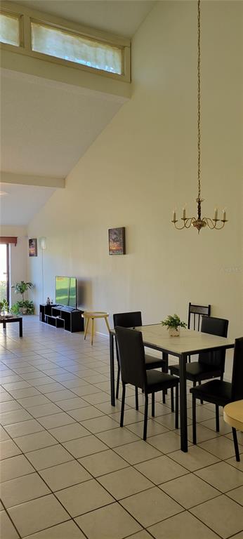 2218 Abbey Road Southwest Winter Haven, FL 33880 - Photo 7 of 31 a view of a dining room with furniture and wooden floor