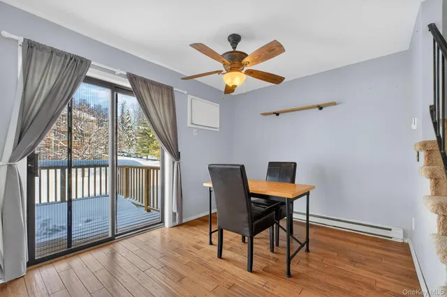 a workspace with wooden floor and a window