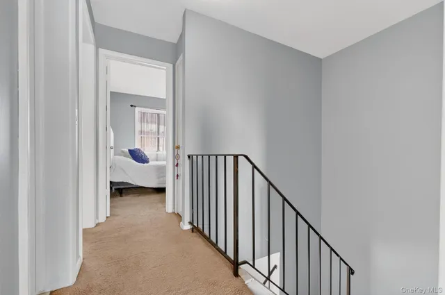 a view of a bedroom from a hallway