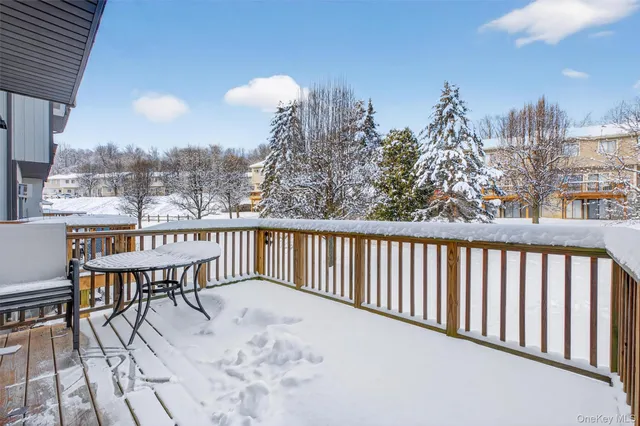 a view of balcony with wooden floor