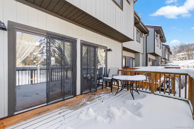 a view of balcony with furniture