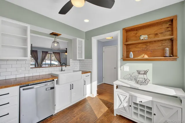 a spacious bathroom with a sink double vanity and a mirror