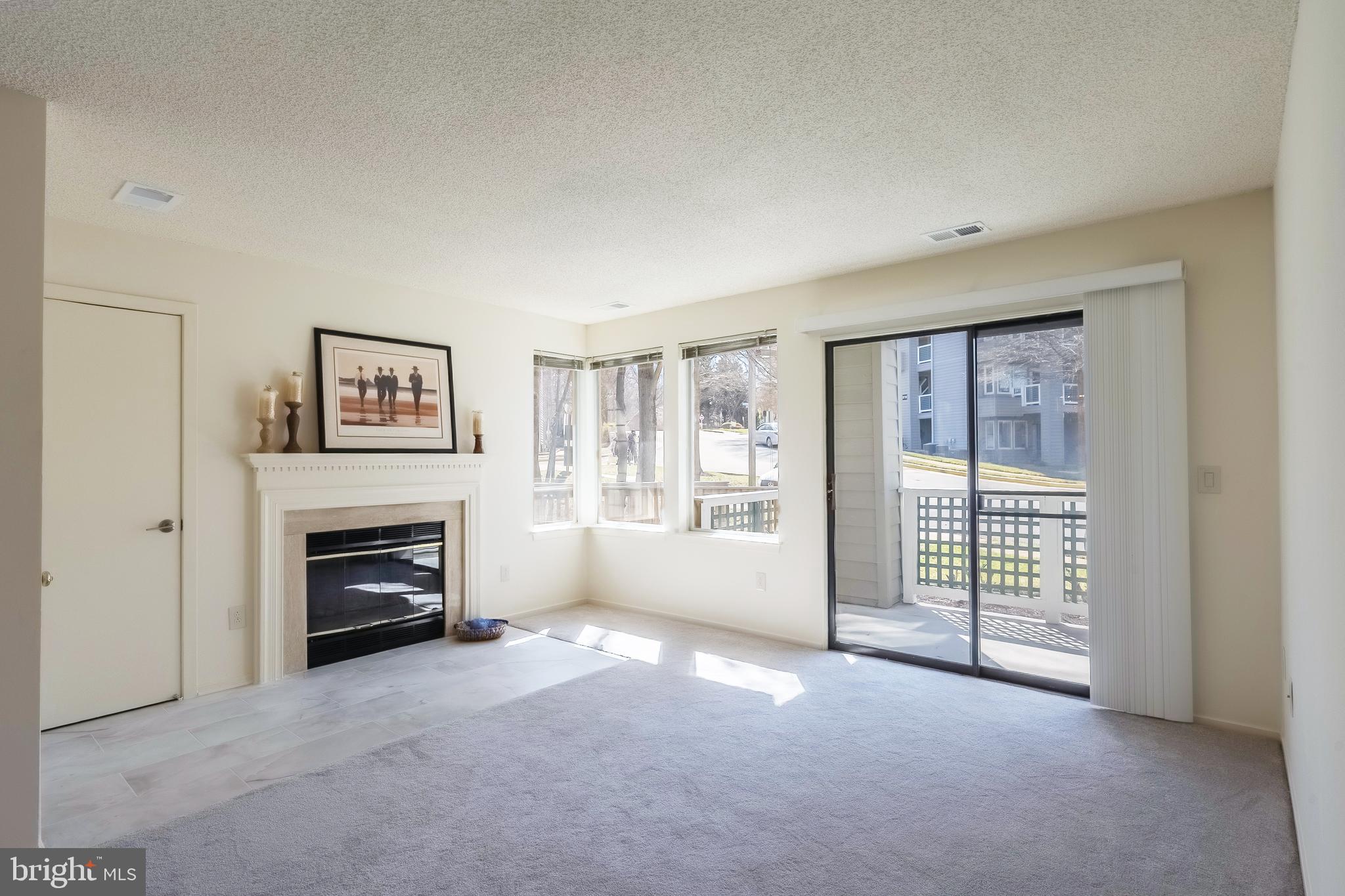 11731 A Summerchase Circle Reston, VA 20194 - Photo 6 of 27 Wood burning fireplace with mantle