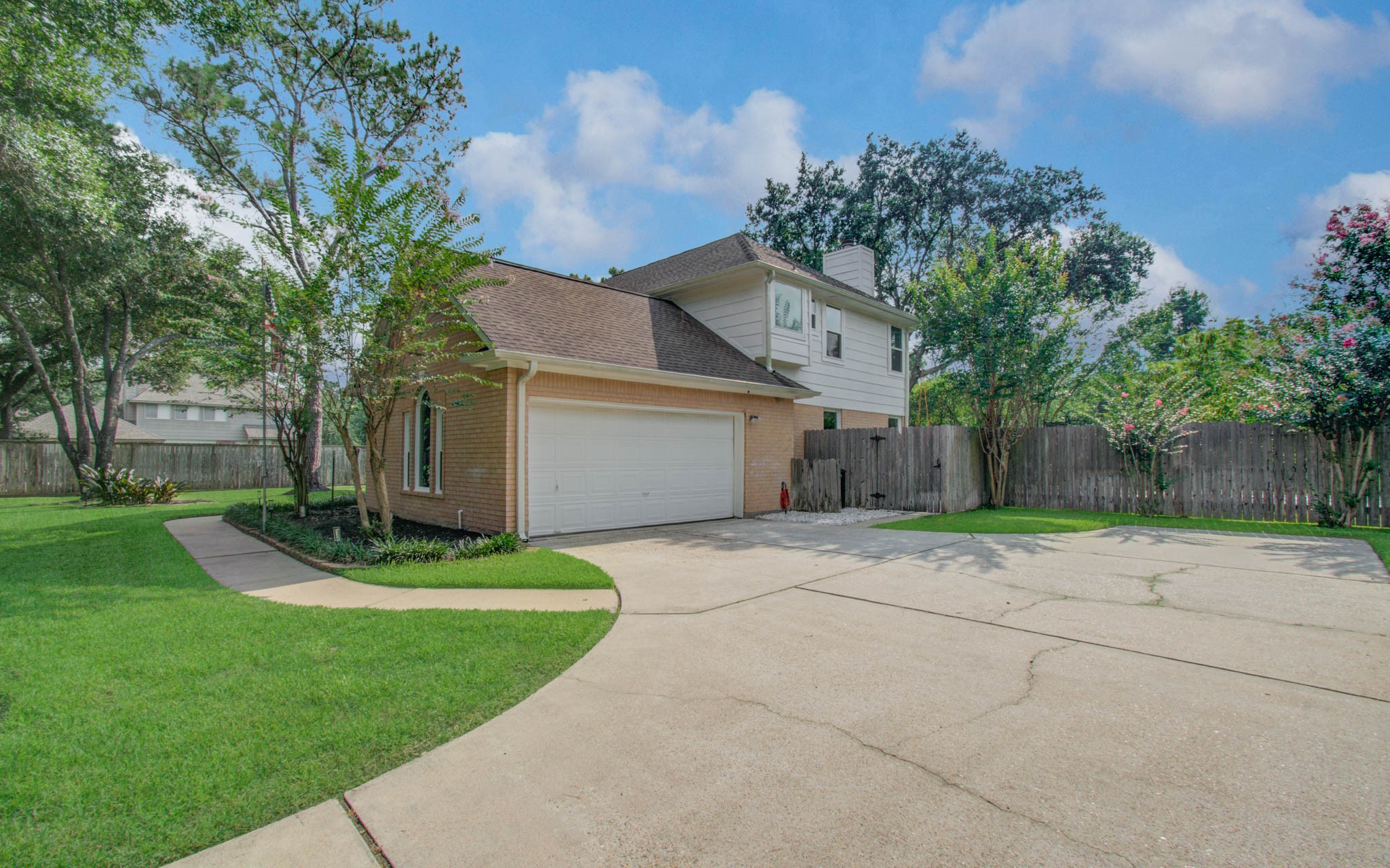 22927 Northoak Forest Lane Spring, TX 77389 - Photo 31 of 37 a front view of a house with a yard and a garage