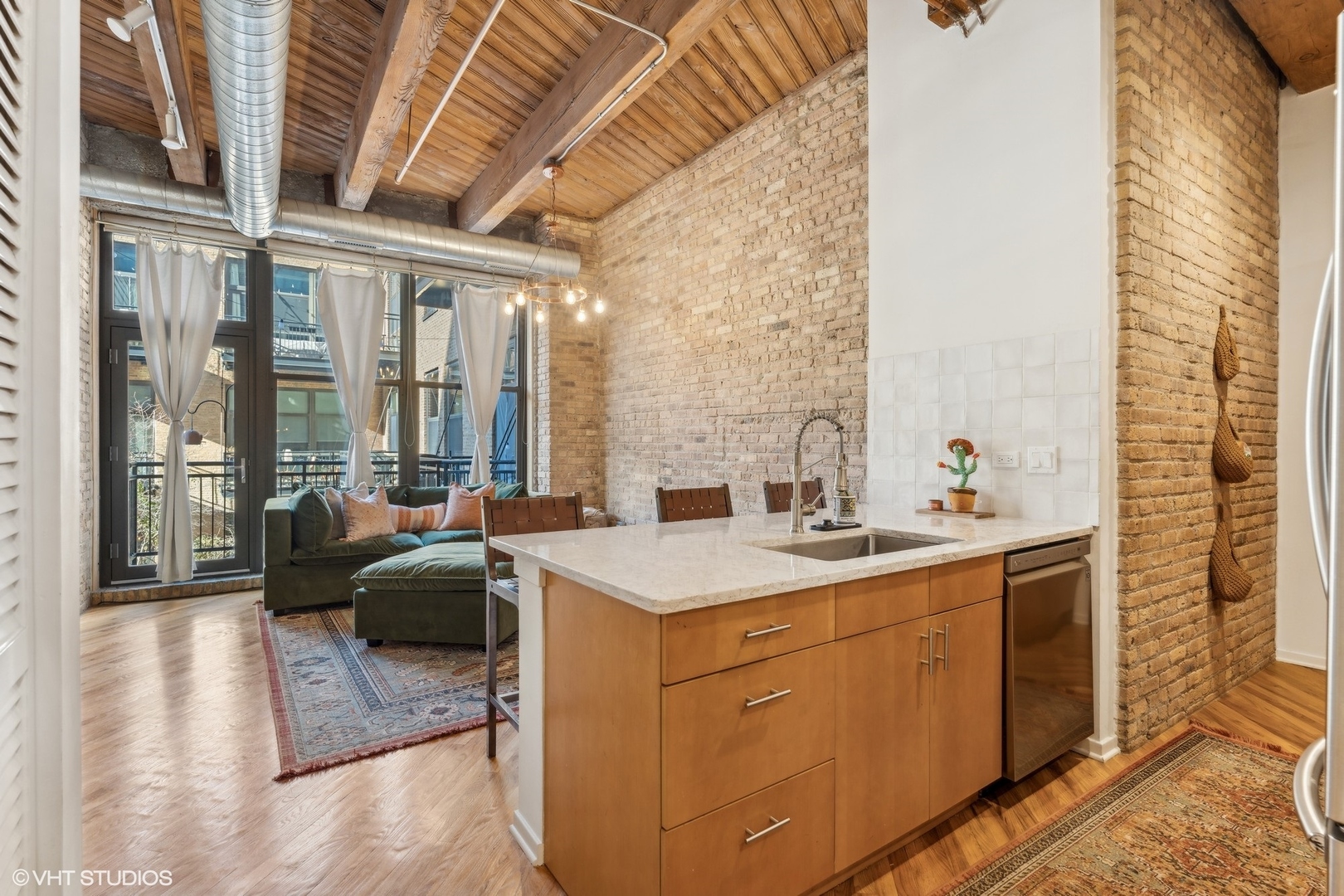 1040 West Adams Street, Unit 308 Chicago, IL 60607 - Photo 11 of 40 a view of a kitchen with a sink and a large window