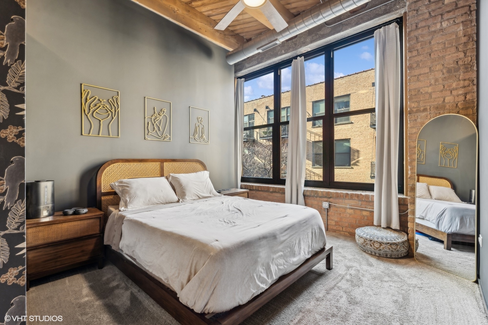 1040 West Adams Street, Unit 308 Chicago, IL 60607 - Photo 16 of 40 a bedroom with a large bed and a balcony view