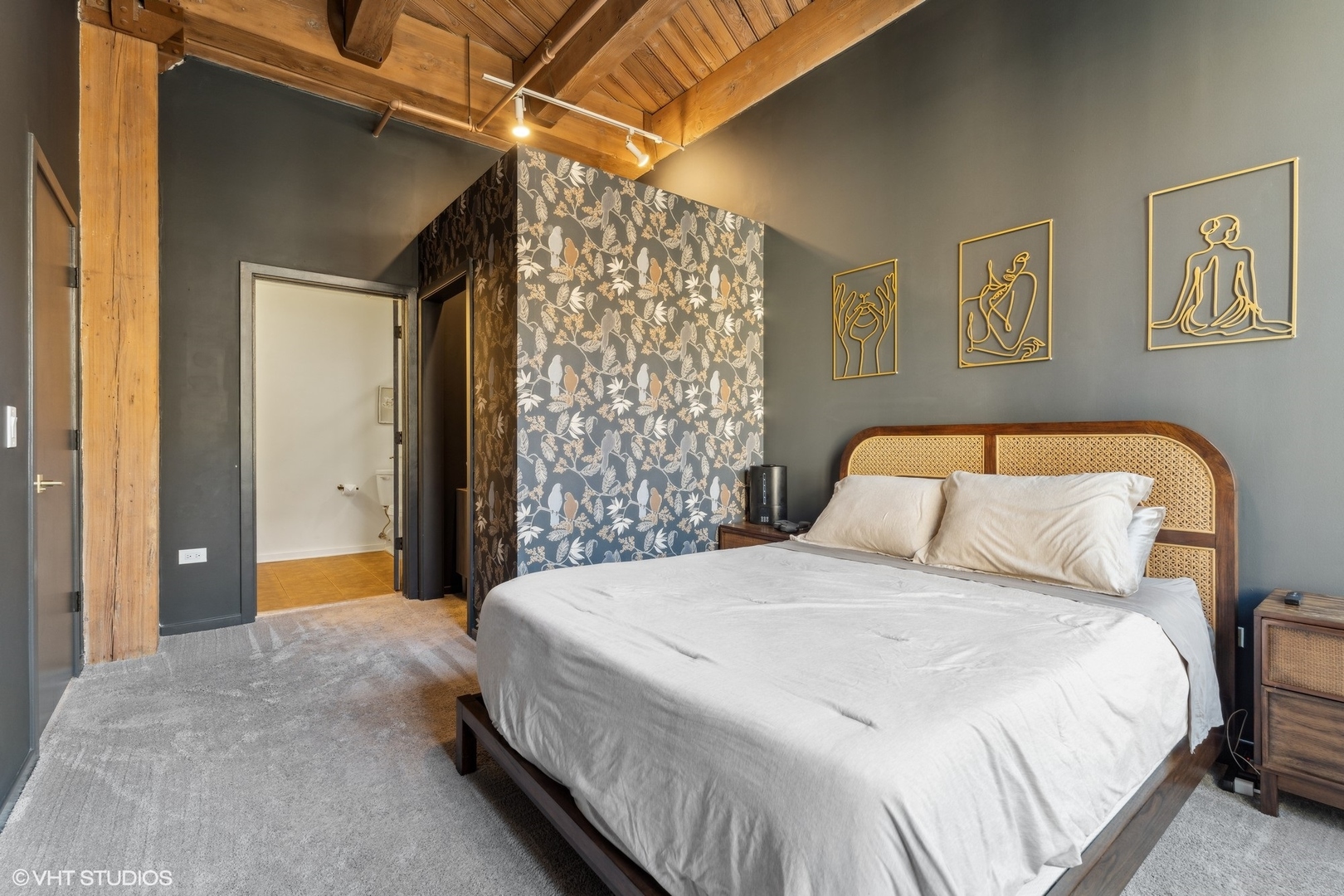 1040 West Adams Street, Unit 308 Chicago, IL 60607 - Photo 17 of 40 a bedroom with a bed and a mirror