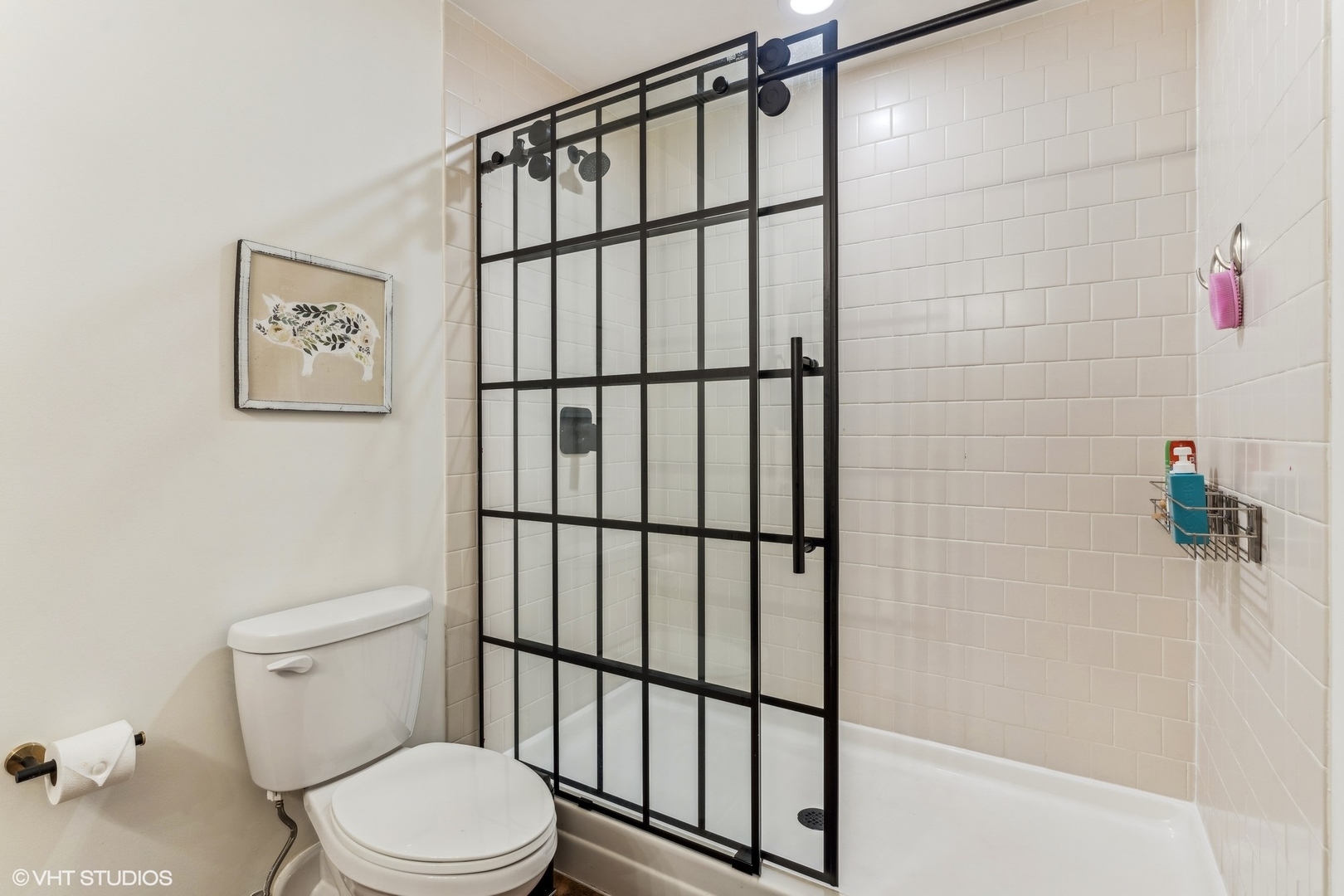 1040 West Adams Street, Unit 308 Chicago, IL 60607 - Photo 19 of 40 a white toilet sitting next to a shower