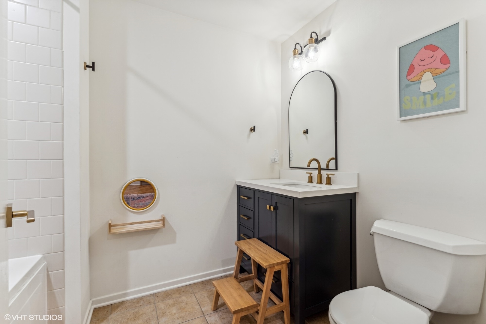 1040 West Adams Street, Unit 308 Chicago, IL 60607 - Photo 25 of 40 a bathroom with a toilet a sink and mirror