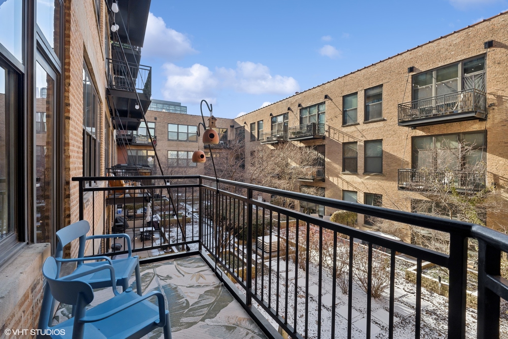 1040 West Adams Street, Unit 308 Chicago, IL 60607 - Photo 27 of 40 a view of a brick building from a balcony