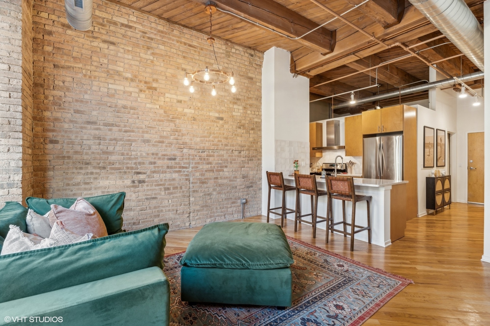 1040 West Adams Street, Unit 308 Chicago, IL 60607 - Photo 6 of 40 a living room with furniture and wooden floor