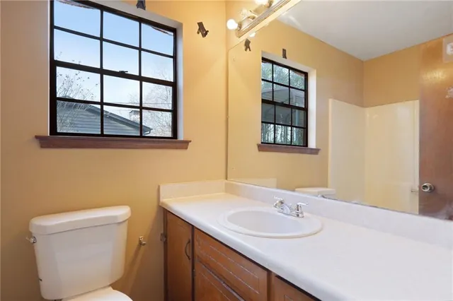 a view of a house with trees in the background