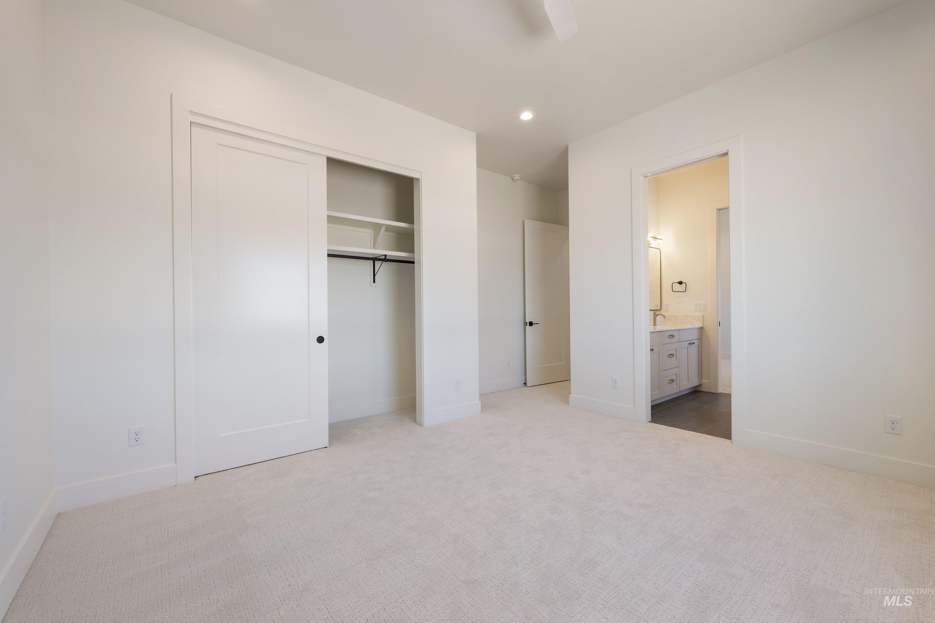 24821 Ardmore Court Caldwell, ID 83607 - Photo 35 of 43 Neutral-toned carpeting paired with white walls