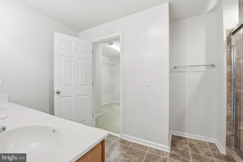 a bathroom with a bathtub and shower