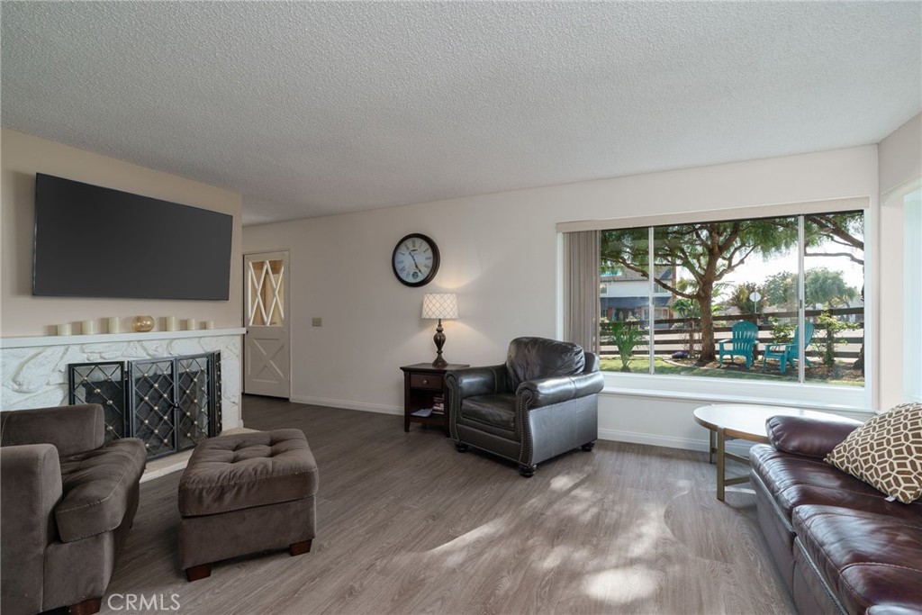 398 Day Road Ventura, CA 93003 - Photo 13 of 69 a living room with furniture a large window and a flat screen tv