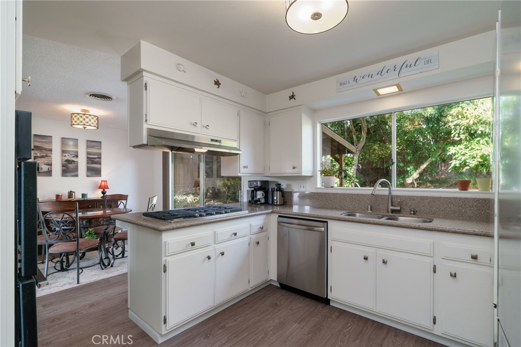 398 Day Road Ventura, CA 93003 - Photo 20 of 69 a kitchen with a sink stove and cabinets