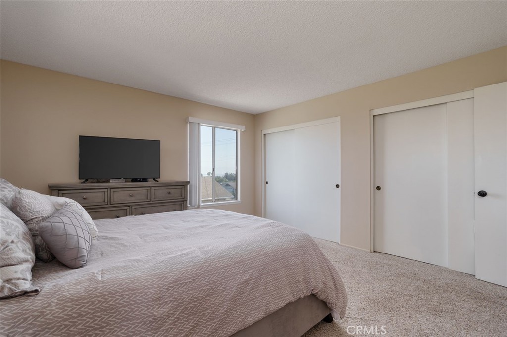 398 Day Road Ventura, CA 93003 - Photo 38 of 69 a bedroom with a bed and a flat screen tv