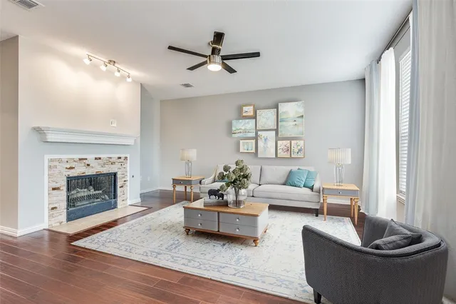 a living room with furniture and a fireplace