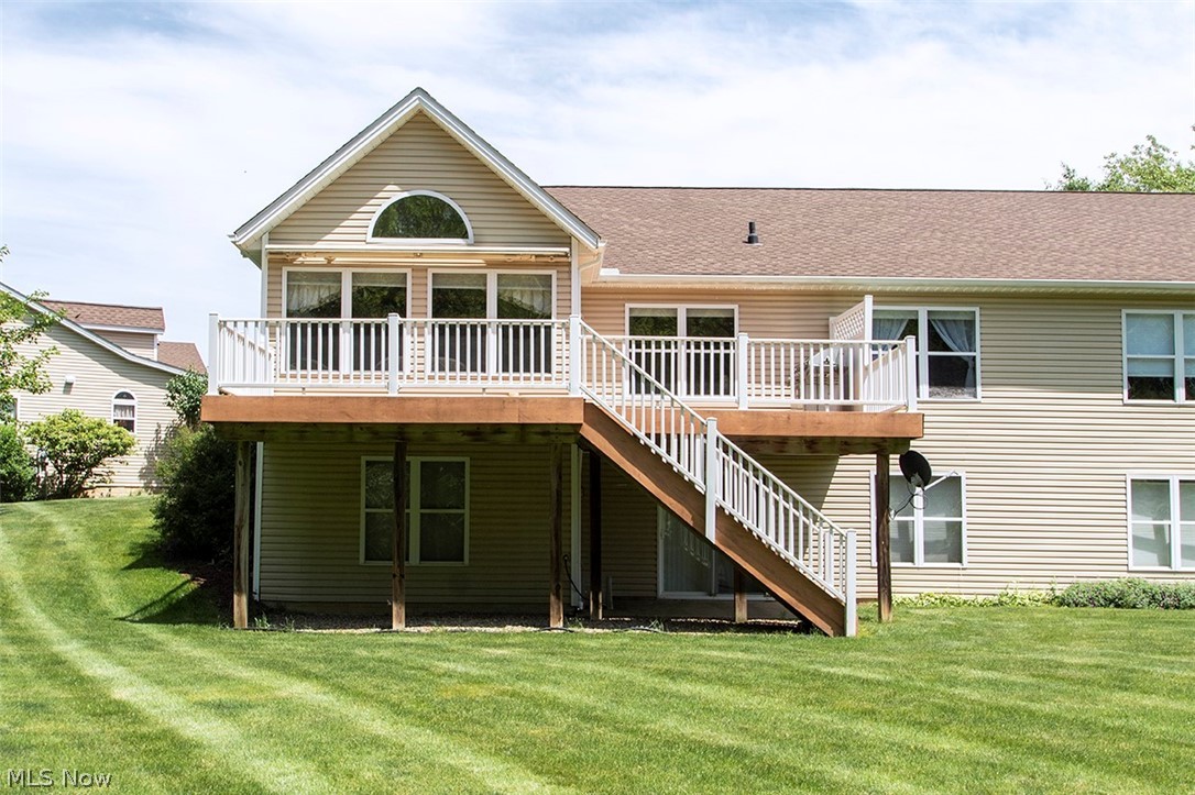 4902 Foote Road, Unit 21 Medina, OH 44256 - Photo 26 of 34 Rear view of house featuring a lawn and a deck