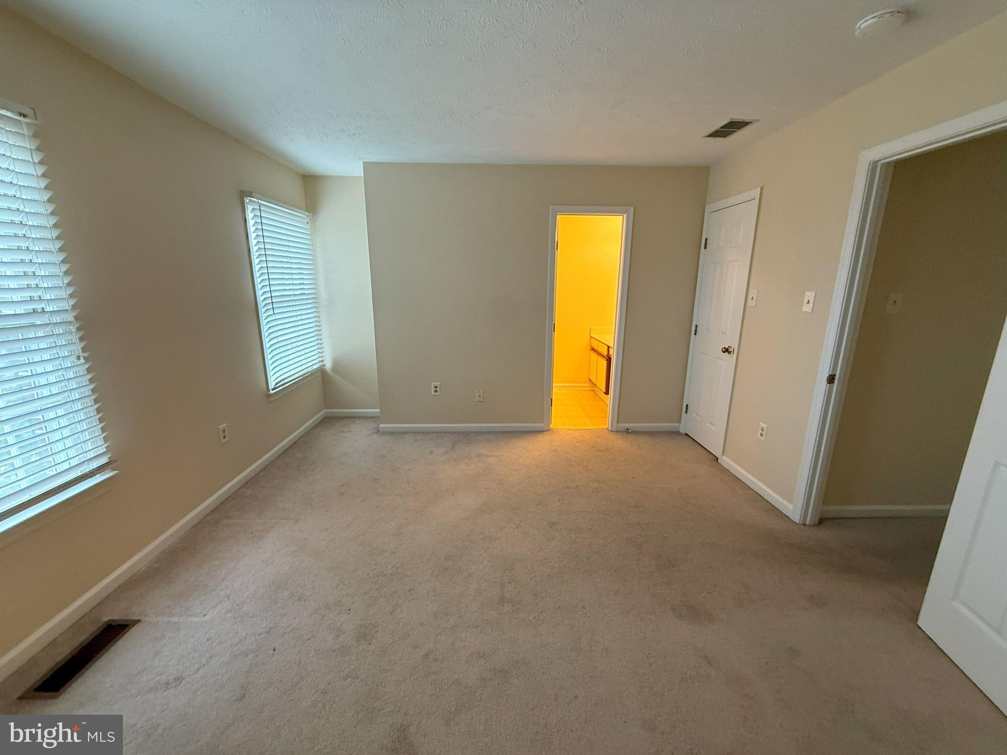 101 Tudor Drive Winchester, VA 22603 - Photo 5 of 13 a view of empty room with window and a fireplace