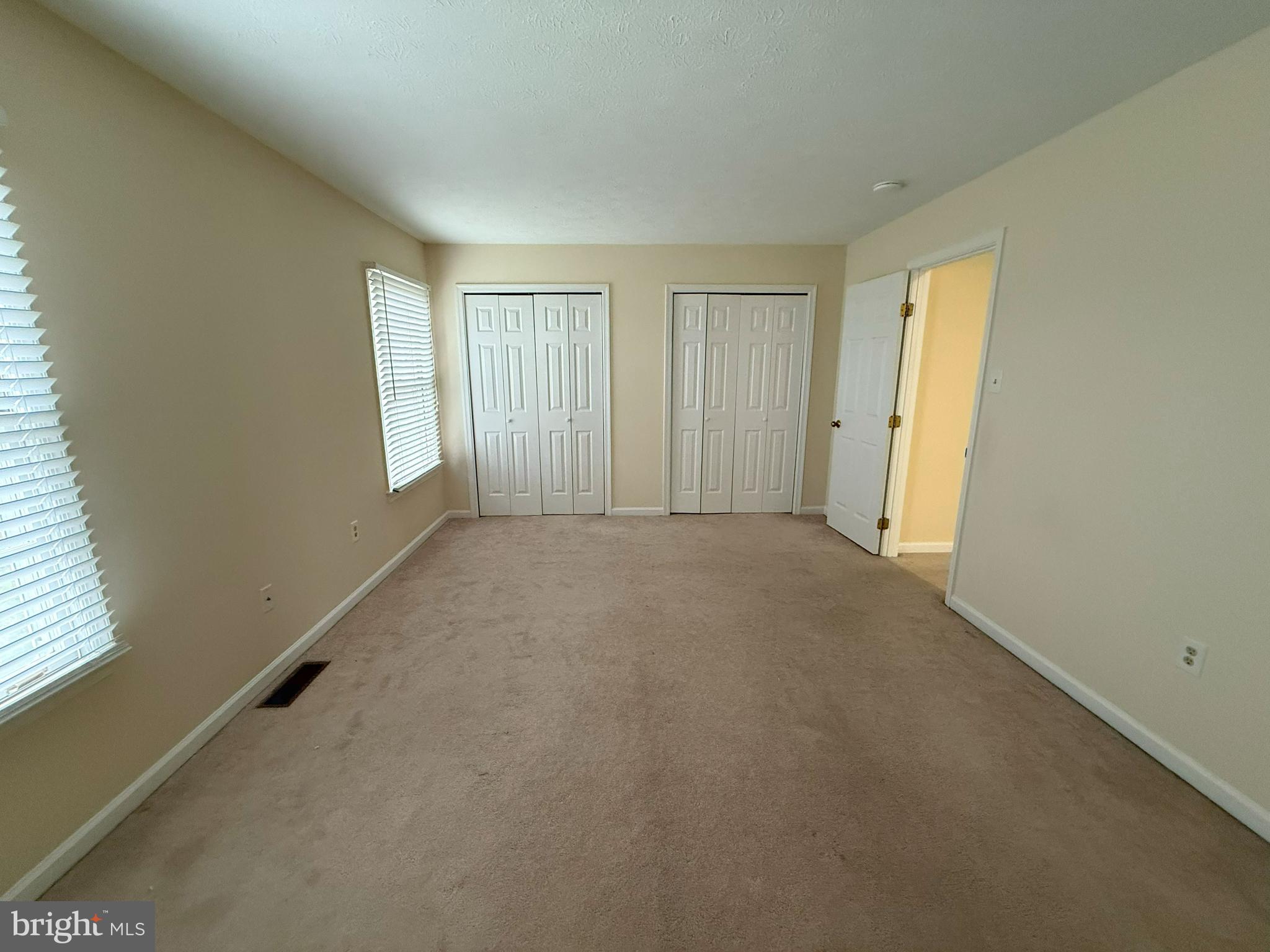 101 Tudor Drive Winchester, VA 22603 - Photo 6 of 13 a view of an empty room and a window