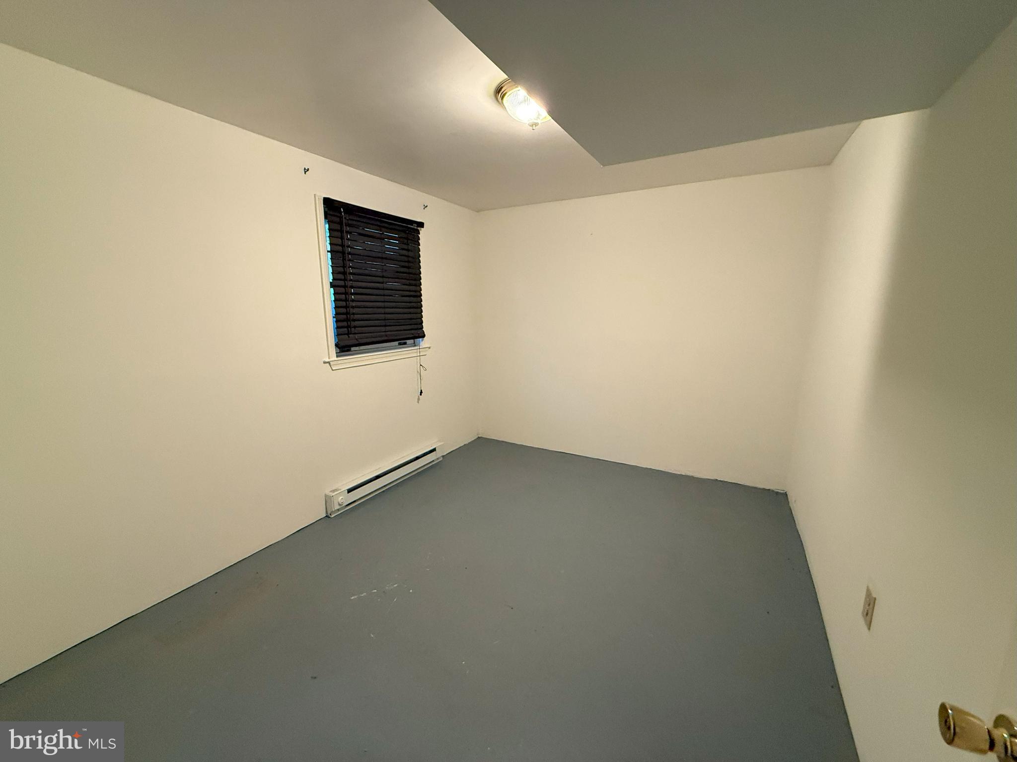 101 Tudor Drive Winchester, VA 22603 - Photo 8 of 13 an empty room with a window