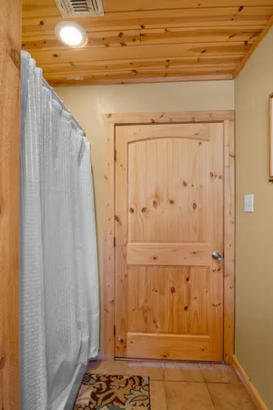 a large bed sitting in a bedroom next to a window