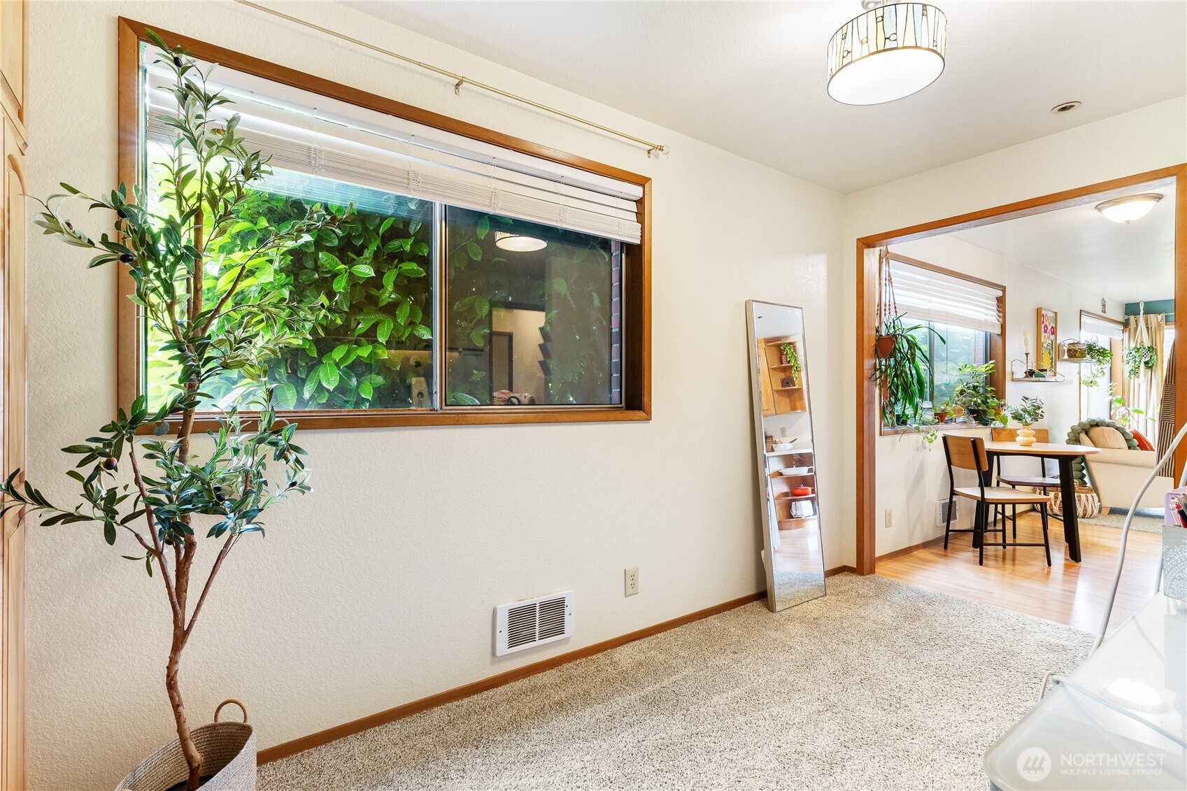 2619 Rucker Avenue, Unit 2 Everett, WA 98201 - Photo 17 of 33 a potted plant sitting in front of a room