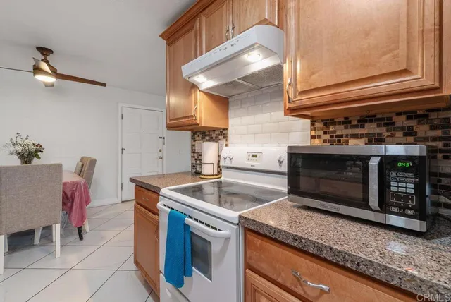 a kitchen with a stove and a sink