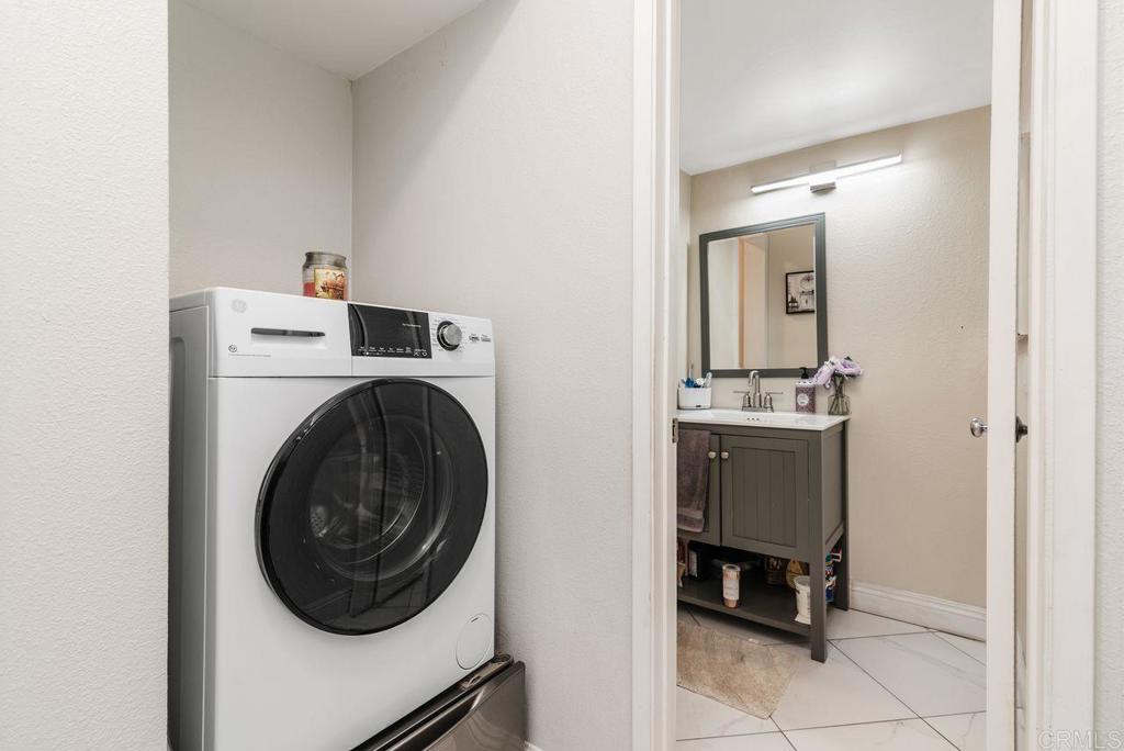 2340 Hosp Way, Unit 120 Carlsbad, CA 92008 - Photo 17 of 33 a utility room with sink dryer and washer