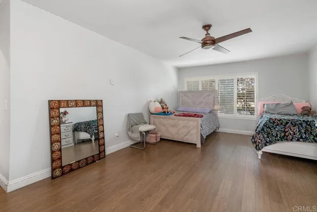 a bedroom with bed and window
