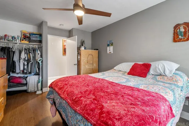 a bedroom with a bed and a walk in closet