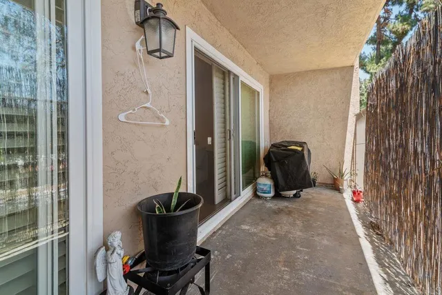 a street sign on a wall next to a road