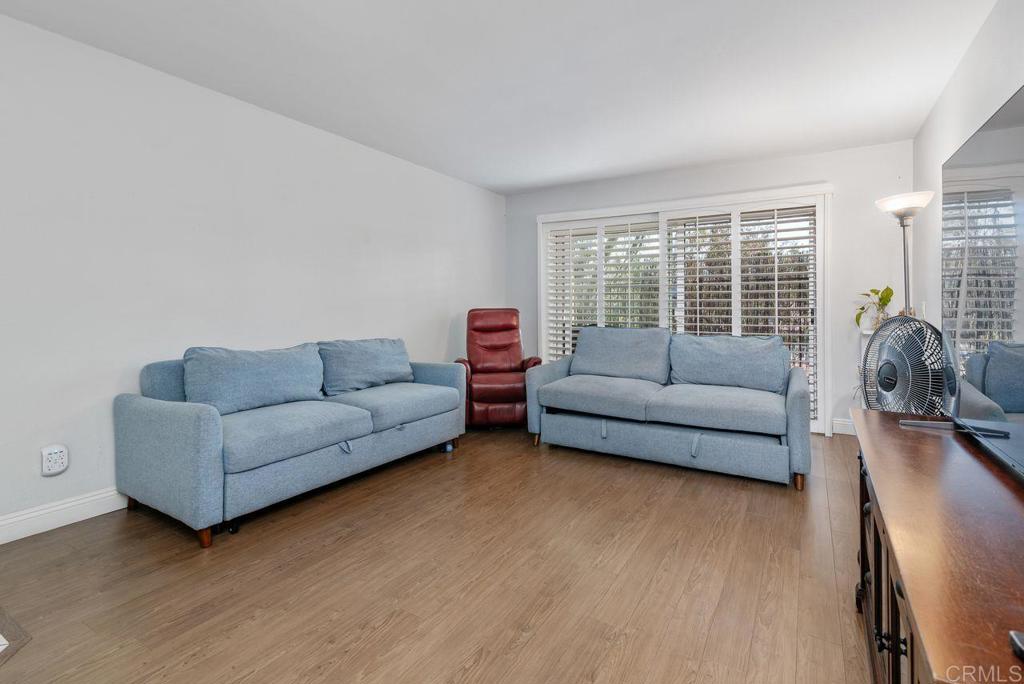 2340 Hosp Way, Unit 120 Carlsbad, CA 92008 - Photo 4 of 33 a living room with furniture and a large window