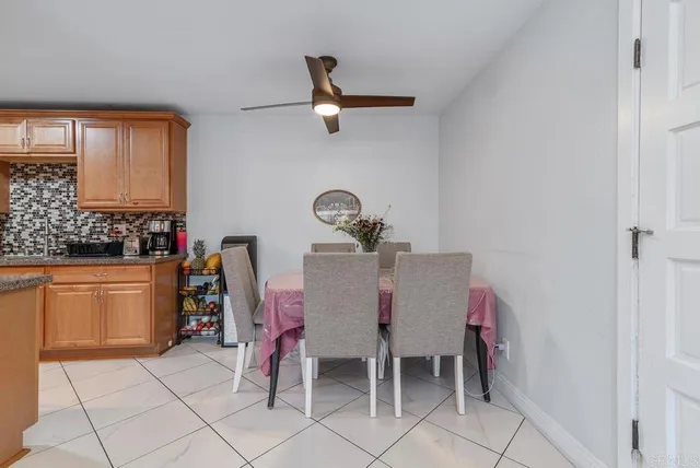 a dining room with furniture and window