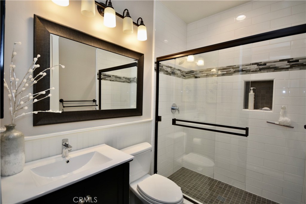 12451 Rancho Heights Road Pala, CA 92059 - Photo 16 of 46 a bathroom with a toilet sink and mirror