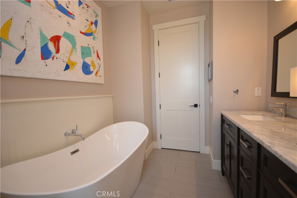 12451 Rancho Heights Road Pala, CA 92059 - Photo 17 of 46 a bathroom with a bathtub and a sink