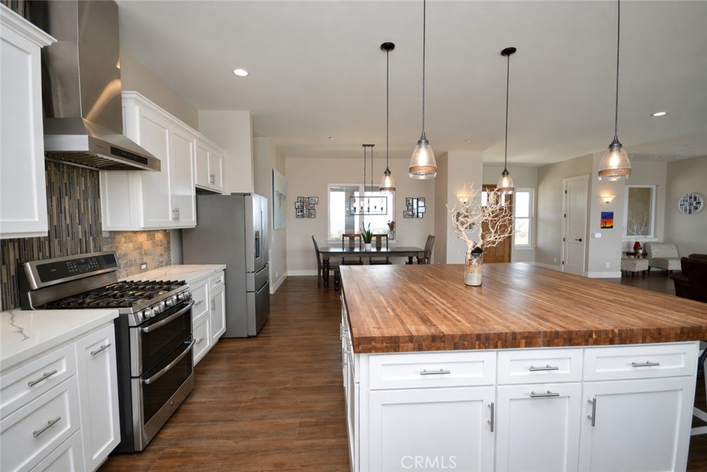 12451 Rancho Heights Road Pala, CA 92059 - Photo 19 of 46 a kitchen with kitchen island a counter top space a sink stainless steel appliances and cabinets