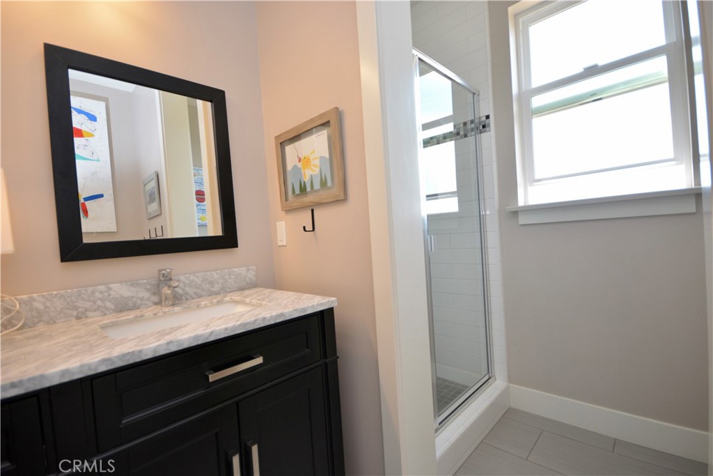 12451 Rancho Heights Road Pala, CA 92059 - Photo 30 of 46 a bathroom with a sink and a mirror