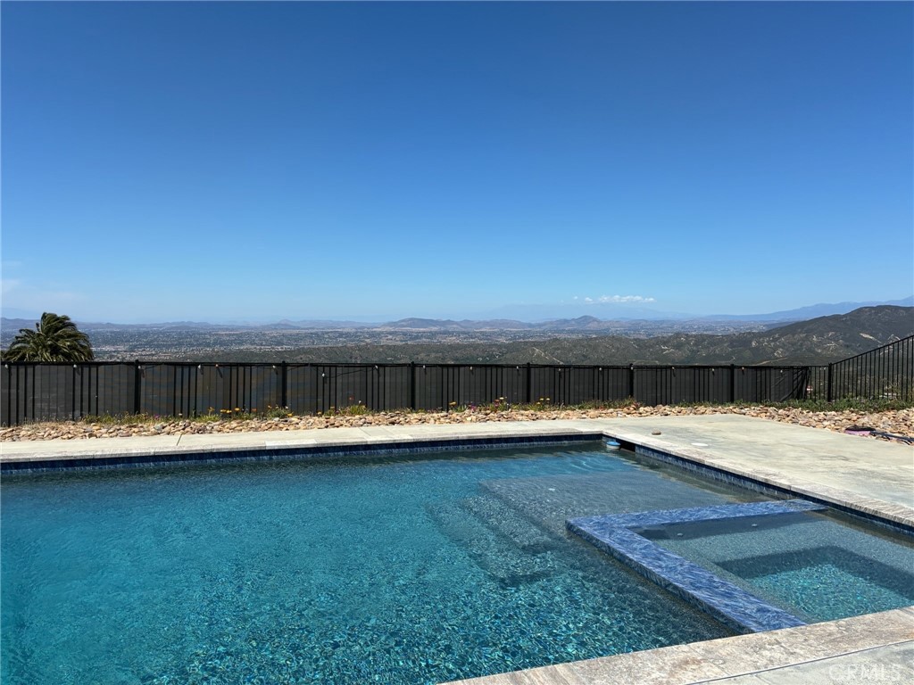 12451 Rancho Heights Road Pala, CA 92059 - Photo 34 of 46 a view of a swimming pool with an ocean