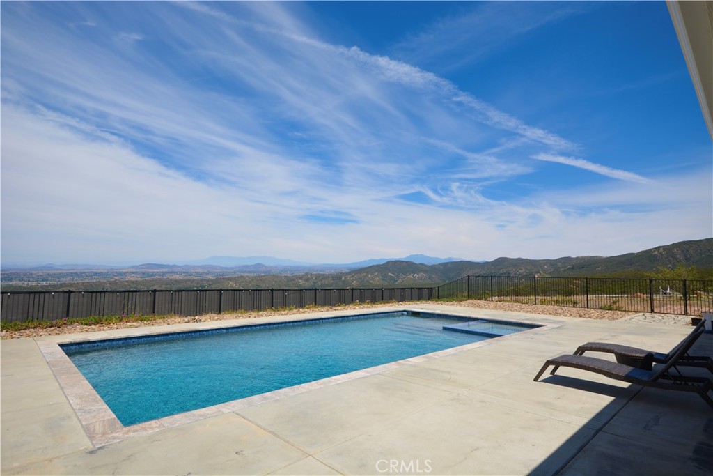 12451 Rancho Heights Road Pala, CA 92059 - Photo 8 of 46 a view of swimming pool with lounge chair in front of house