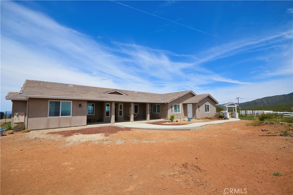 12451 Rancho Heights Road Pala, CA 92059 - Photo 10 of 46 a front view of a house with a yard